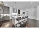 Sleek kitchen with white and dark gray cabinetry and breakfast bar at 1301 Peachtree # 3B, Atlanta, GA 30309
