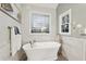 Relaxing bathroom featuring a large soaking tub and a stylish design at 2030 Hedge Row, Lawrenceville, GA 30043