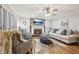 Living room with hardwood floors, a fireplace, and comfortable seating at 2030 Hedge Row, Lawrenceville, GA 30043