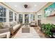 Sunroom featuring wicker furniture and large windows at 2030 Hedge Row, Lawrenceville, GA 30043