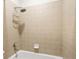 Clean bathroom with shower/tub combo and beige tile at 2921 Lenox Ne Rd # 201, Atlanta, GA 30324