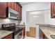 Kitchen with granite countertops and stainless steel appliances at 2921 Lenox Ne Rd # 201, Atlanta, GA 30324