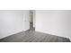 Bedroom with wood-look floors and door to another room at 6876 Wildboar Dr, Fairburn, GA 30213