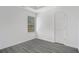 Simple bedroom with wood-look floors and window at 6876 Wildboar Dr, Fairburn, GA 30213