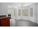 Kitchen dining area with bay window and gray vinyl flooring at 6876 Wildboar Dr, Fairburn, GA 30213