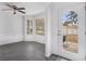 Bright dining room with bay window and gray vinyl flooring at 6876 Wildboar Dr, Fairburn, GA 30213