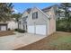 Two-story house with a two-car garage and brick facade at 6876 Wildboar Dr, Fairburn, GA 30213