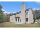 Two-story house with a large backyard and attached garage at 6876 Wildboar Dr, Fairburn, GA 30213