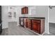 Kitchen with dark wood cabinets, black appliances, and granite countertops at 6876 Wildboar Dr, Fairburn, GA 30213