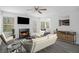 Cozy living room with fireplace and plenty of natural light at 6876 Wildboar Dr, Fairburn, GA 30213