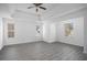 Spacious main bedroom with gray vinyl flooring and multiple windows at 6876 Wildboar Dr, Fairburn, GA 30213