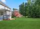 Spacious backyard with green lawn and a view of the deck at 3247 Brigadier Way, Stockbridge, GA 30281
