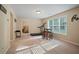 Finished basement with a treadmill and seating area at 3247 Brigadier Way, Stockbridge, GA 30281