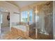 Bathroom with soaking tub, shower, and tile flooring at 3247 Brigadier Way, Stockbridge, GA 30281