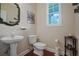 Clean bathroom with pedestal sink, toilet and hardwood floor at 3247 Brigadier Way, Stockbridge, GA 30281