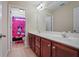 Double vanity bathroom with a pink Mickey Mouse theme at 3247 Brigadier Way, Stockbridge, GA 30281