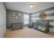 bedroom with gray walls and a striped accent wall at 3247 Brigadier Way, Stockbridge, GA 30281