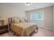 Comfortable bedroom with a queen-size bed and access to outside at 3247 Brigadier Way, Stockbridge, GA 30281