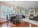 Bright dining area with hardwood floors and views of the Gathering room and fireplace at 3247 Brigadier Way, Stockbridge, GA 30281
