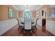 Formal dining room with hardwood floors, chandelier, and large windows at 3247 Brigadier Way, Stockbridge, GA 30281