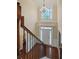 Two-story entryway with hardwood floors, a chandelier, and a view of the front door at 3247 Brigadier Way, Stockbridge, GA 30281