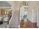 Two-story entryway with hardwood floors, a staircase with iron railing, and neutral color palette at 3247 Brigadier Way, Stockbridge, GA 30281