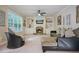 Gathering room features a fireplace, built-in shelving, and a cozy seating area at 3247 Brigadier Way, Stockbridge, GA 30281