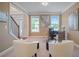 Bright home office with hardwood floors, two armchairs, and a desk with two computers at 3247 Brigadier Way, Stockbridge, GA 30281