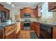Kitchen with granite countertops, wooden cabinets, and stainless steel appliances at 3247 Brigadier Way, Stockbridge, GA 30281