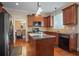 Kitchen with granite countertops, wooden cabinets, and stainless steel appliances at 3247 Brigadier Way, Stockbridge, GA 30281