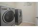 Laundry room with washer, dryer and shelving at 3247 Brigadier Way, Stockbridge, GA 30281