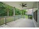 Covered porch with ceiling fan and wooded views at 3247 Brigadier Way, Stockbridge, GA 30281
