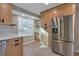 Spacious kitchen with stainless steel appliances and light wood cabinets at 3910 Ardsley Dr, Marietta, GA 30062