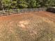 Large backyard with a wooden fence, providing ample space for outdoor activities at 114 Muirwood Dr, Temple, GA 30179