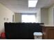 Spacious basement with large sectional sofa and window at 114 Muirwood Dr, Temple, GA 30179