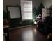 Spacious bedroom with dark hardwood floors and a large mirror at 114 Muirwood Dr, Temple, GA 30179