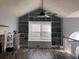 Spacious living room with built-in shelving and hardwood floors at 114 Muirwood Dr, Temple, GA 30179