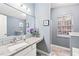 Bathroom with granite countertop and a large mirror at 2403 Barndale Dr, Lawrenceville, GA 30044