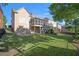 Expansive backyard with a well-maintained lawn, fenced perimeter, and screened in porch at 4685 Prater Se Way, Smyrna, GA 30080