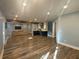 Open-concept finished basement with wet bar, cozy seating area, and modern lighting at 4685 Prater Se Way, Smyrna, GA 30080
