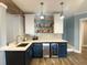 Finished basement bar with dark cabinets, marble countertops and beverage refrigerator at 4685 Prater Se Way, Smyrna, GA 30080