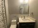 Modern bathroom featuring marble-look tile, a sleek vanity, and contemporary fixtures at 4685 Prater Se Way, Smyrna, GA 30080