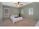 Neutral bedroom with a guitar against the wall and two windows allowing natural light at 4685 Prater Se Way, Smyrna, GA 30080