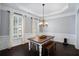 Traditional dining room showcases wainscoting, elegant lighting, and a classic table set at 4685 Prater Se Way, Smyrna, GA 30080
