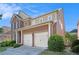 Brick home with 2-car garage and well-maintained landscaping in a suburban neighborhood at 4685 Prater Se Way, Smyrna, GA 30080