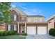 Charming brick two-story home with a well-maintained lawn and an attached two-car garage at 4685 Prater Se Way, Smyrna, GA 30080