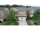 Exterior of a two-story brick and siding home with a well-manicured front yard and driveway at 4685 Prater Se Way, Smyrna, GA 30080