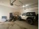 Large garage with automatic door opener provides ample space for a Jeep, lawnmower, and other storage at 4685 Prater Se Way, Smyrna, GA 30080