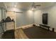 Home gym featuring a sliding barn door, treadmill, and wall-mounted workout equipment at 4685 Prater Se Way, Smyrna, GA 30080