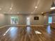 Spacious living room featuring hardwood floors, recessed lighting, and a walk-out door to the patio area at 4685 Prater Se Way, Smyrna, GA 30080